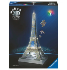 Ravensburger 3D-Puzzle der Eiffelturm mit LED, Verpackung und Puzzleteilen neben dem fertigen Modell.