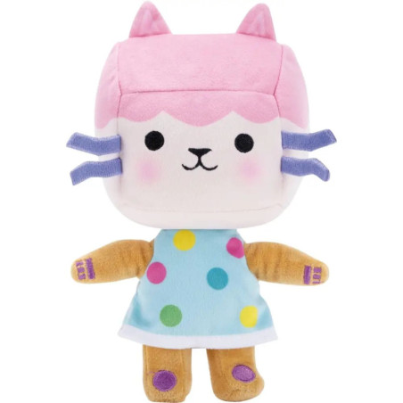 Plüschkatze mit rosa Kopf, blauem Kleid mit Punkten und lila Schnurrhaaren steht aufrecht.