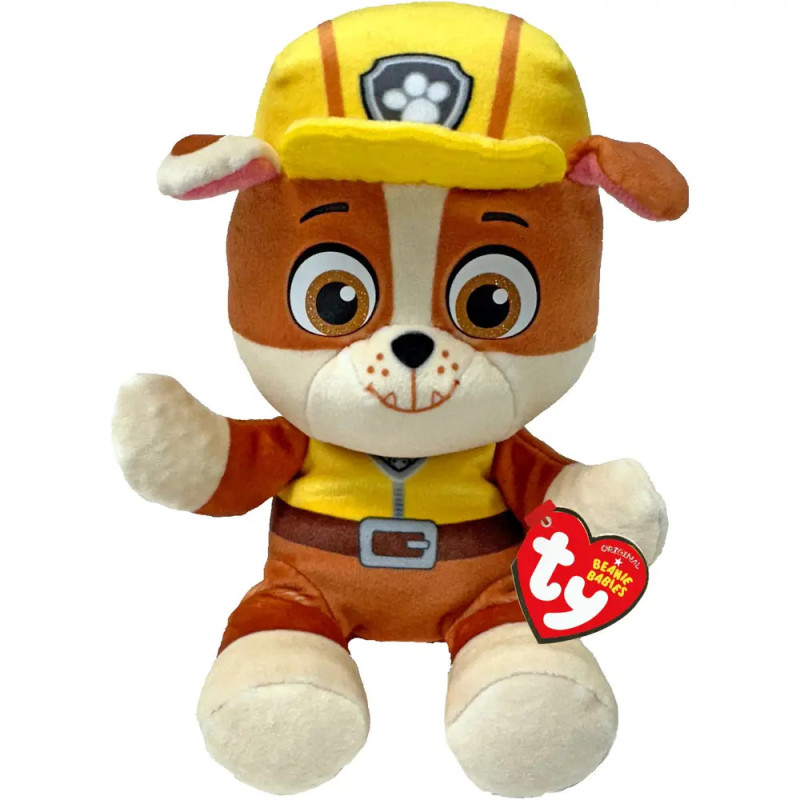 Plüschtier von Rubble aus PAW Patrol mit gelbem Hut und Weste, hält ein rotes TY Beanie Babies Etikett.