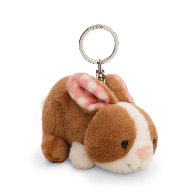 Braun-weißer Plüschhasen-Schlüsselanhänger mit rosa gemusterten Ohren vor weißem Hintergrund.