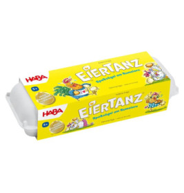 Gelbe Schachtel mit Aufschrift Eiertanz und Comic-Hühnern, ähnelt optisch einem Eierkarton.