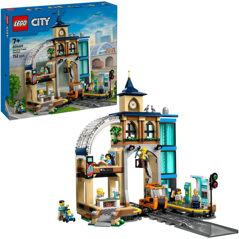 LEGO City Set mit Bahnhof, Minifiguren und Verpackung, die das aufgebaute Modell zeigt.