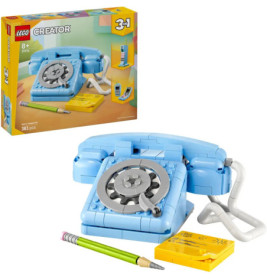 LEGO Creator 3-in-1: Blaues Wählscheibentelefon mit Bleistift und gelbem Notizblock, Verpackung im Hintergrund.