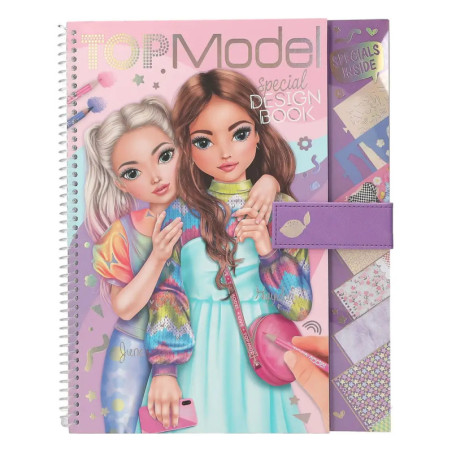 Zwei gezeichnete Mädchen auf einem spiralgebundenen Top Model Designbuch mit lilafarbener Klammer und Musterproben.