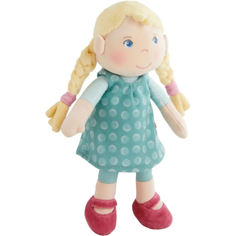 Stoffpuppe mit blonden Zöpfen, blauen Augen, türkisem gepunkteten Kleid und rosa Schuhen.