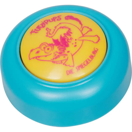 Blauer Spielzeugknopf mit gelber Mitte, Cartoon-Vogel und der Aufschrift Furzkaps Die Spezialbung.