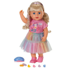Blonde Puppe im pinken Meerjungfrau-Outfit mit Tutu, pinken Schuhen und vorne platzierten Haaraccessoires.