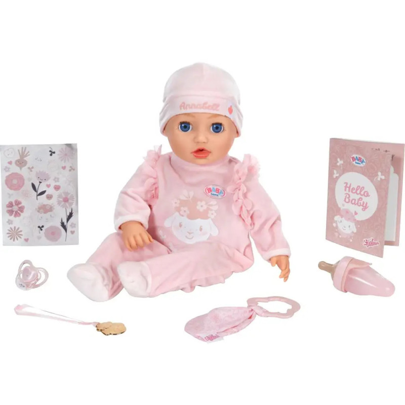 Babypuppe im rosa Outfit mit Zubehör: Flasche, Schnuller, Lätzchen, Buch und Heft mit Blumenmuster.