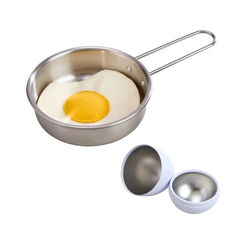 Eine Metallpfanne mit einem Spiegelei-Kissen und zwei geöffneten, eiförmigen Behältern daneben.