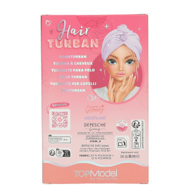 Pinkfarbene TOPModel-Haarturban-Box mit gezeichneter Mädchenfigur im lila Turban und Anleitung auf der Rückseite.