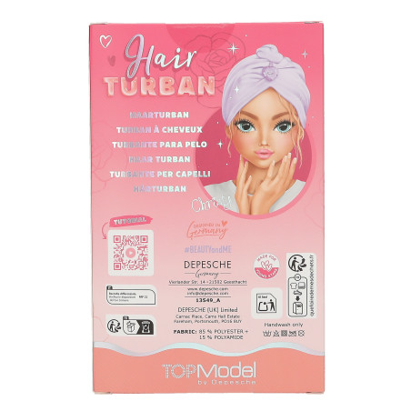 Pinkfarbene TOPModel-Haarturban-Box mit gezeichneter Mädchenfigur im lila Turban und Anleitung auf der Rückseite.