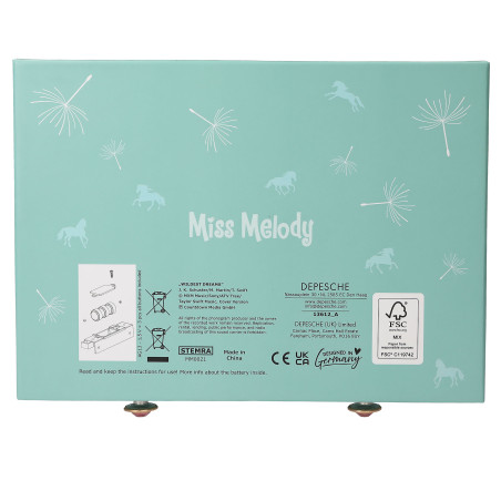 Türkise Miss Melody Box mit weißen Pusteblumen, Pferden und Produktinformationen auf der Rückseite.