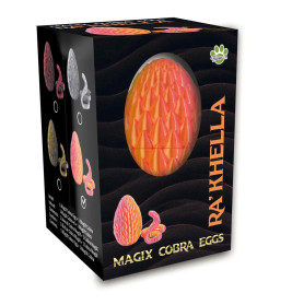 Schwarze Box mit RAKHELLA-Aufschrift, strukturiertem Orangen-Ei und rosa Kobra-Spielzeug, Titel: MAGIX KOBRA-EIER.