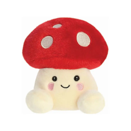 Plüschpilz mit rotem Hut, weißen Punkten, lachendem Gesicht und rosa Wangen vor weißem Hintergrund.
