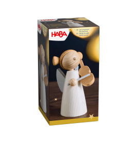 HABA-Box mit hölzernem Engel und Leier vor Sternenhintergrund.