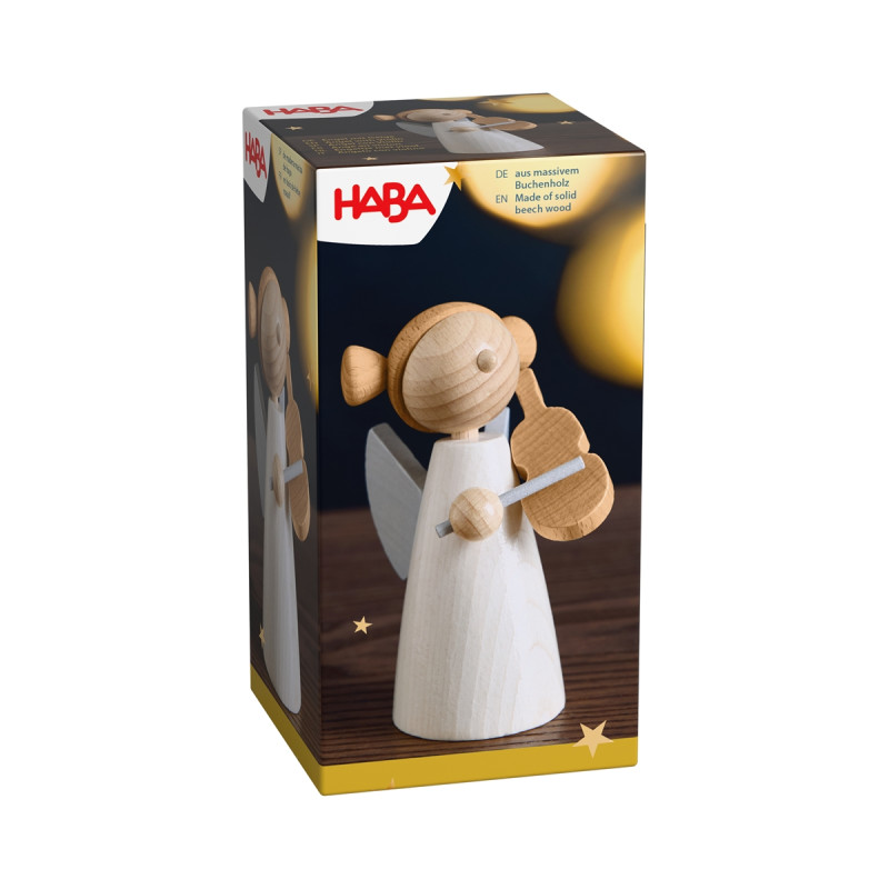 HABA-Box mit hölzernem Engel und Leier vor Sternenhintergrund.