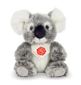 Plüsch-Koala in Grau und Weiß mit Halsband, sitzt aufrecht vor weißem Hintergrund.