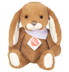 Plüschhase, braun mit langen Ohren, weißen Pfoten und lila Schal mit Punkten, sitzt aufrecht.