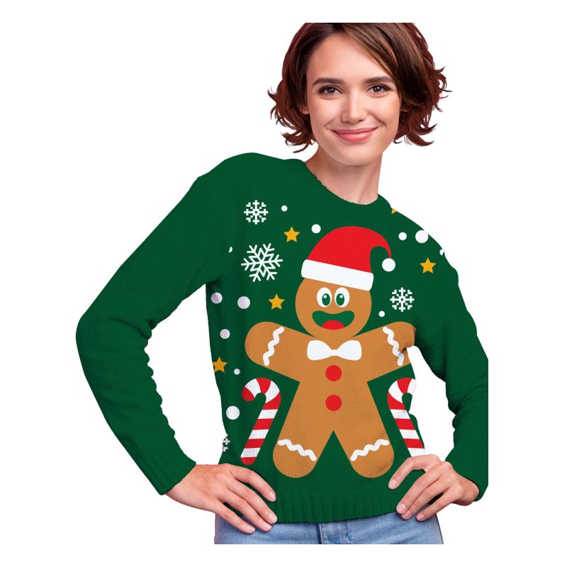 Frau trägt grüne Weihnachtspullover mit Lebkuchenmann, Zuckerstangen, Sternen und Schneeflocken.