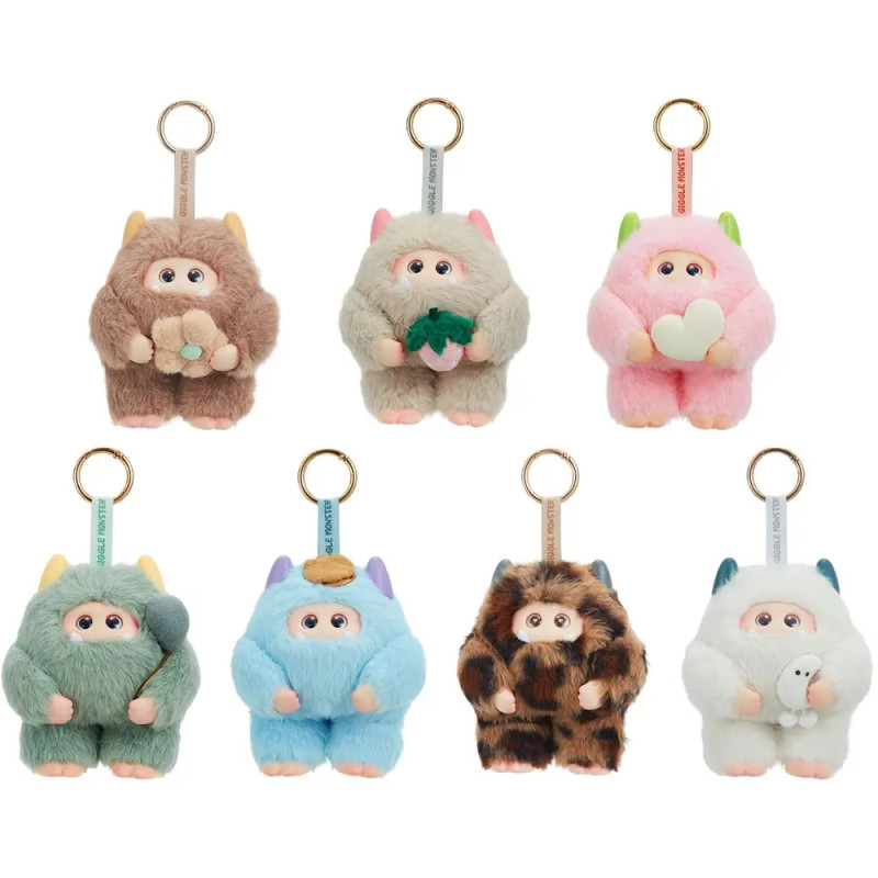 Sieben bunte Yeti-Plüschanhänger mit verschiedenen Gegenständen, in zwei Reihen auf weißem Hintergrund angeordnet.