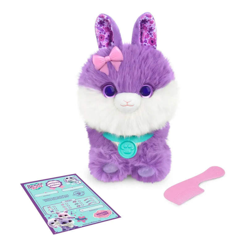 Plüschiges lila-weißes Tier mit rosa Schleife, türkisem Halsband, pinkem Kamm und Spielkarte.