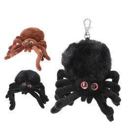 Drei Plüsch-Spinnen-Schlüsselanhänger (schwarz, braun, schwarz mit Clip) mit großen Augen und weichen Beinen.
