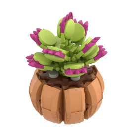 Eine LEGO-Venusfliegenfalle mit grünen Blättern und violetten Spitzen steht in einem runden, braunen LEGO-Topf.