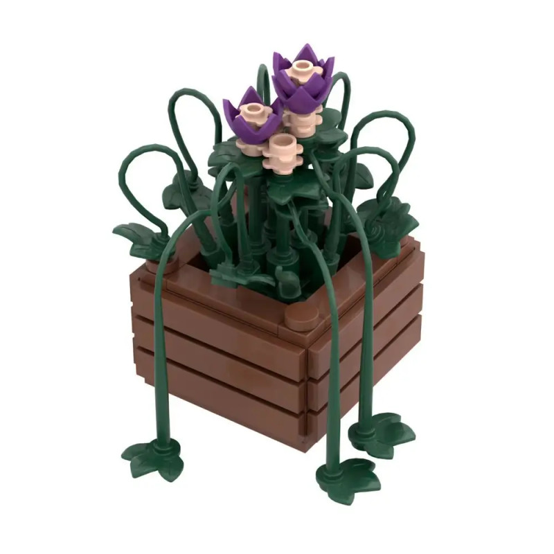 LEGO-Blumenkasten mit lila und beigen Blumen sowie grünen Blättern in einem braunen, rechteckigen Pflanzgefäß.