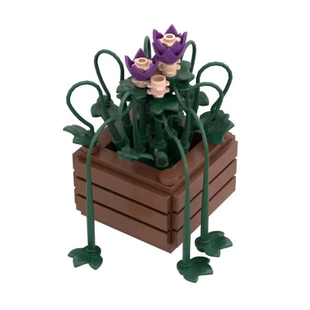 LEGO-Blumenkasten mit lila und beigen Blumen sowie grünen Blättern in einem braunen, rechteckigen Pflanzgefäß.
