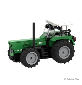 Grün-schwarzes LEGO-Traktormodell mit großen Reifen und weißem Dach.