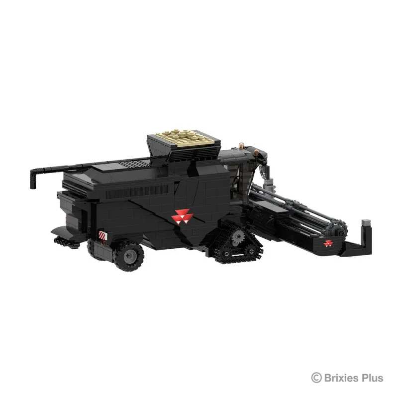 Schwarzes LEGO-Erntefahrzeug mit rotem Dreieckssymbol und goldenen Steinen, präsentiert vor weißem Hintergrund.