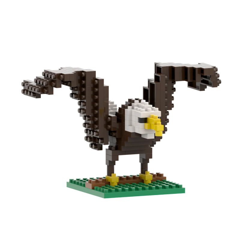 Brixies Adler aus Stecksteinen mit ausgebreiteten Flügeln steht auf grüner Basis.