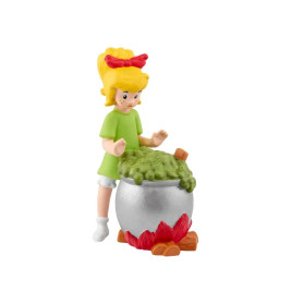 Bibi Blocksberg mit blondem Haar und grünem Kleid rührt in einem Kessel - tonies® Bibi Blocksberg: Aushext.