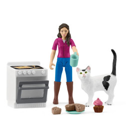 Spielfigur mit Tasse, weiße Katze, Ofen, Muffins, Brownies und Cupcake mit rosa Zuckerguss.