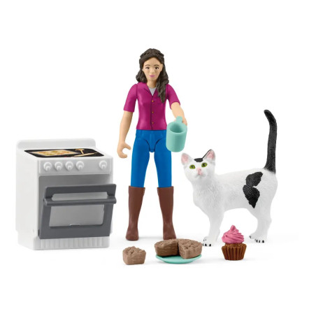 Spielfigur mit Tasse, weiße Katze, Ofen, Muffins, Brownies und Cupcake mit rosa Zuckerguss.