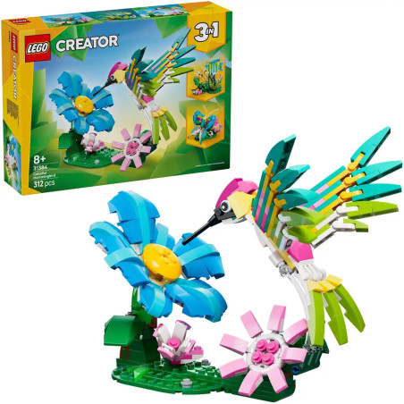 LEGO Creator Set: Bunter Kolibri mit Blumen, fertig aufgebaut und auf der Verpackung abgebildet.