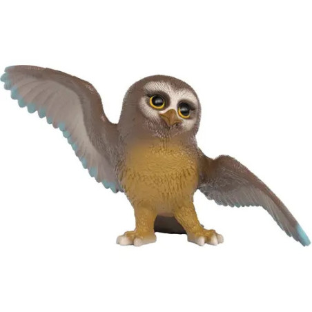 Eine Eulenfigur aus Spielzeug, braun-gelb gefärbt, mit erhobenem Flügel und neugierigem Gesichtsausdruck.
