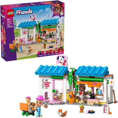 LEGO Friends Set mit Tierklinik, Tierfiguren, Minifiguren und der Setverpackung im Hintergrund.
