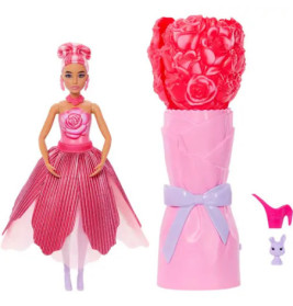 Puppe im rosa Kleid mit Blumen, dazu ein Blütenbehälter, ein Schuh und eine kleine Hasenfigur.