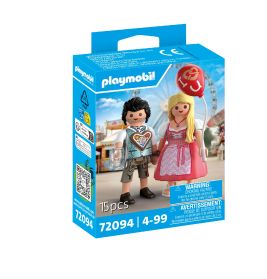 Playmobil-Box mit zwei Figuren in bayerischer Tracht, eine hält einen roten Ballon und eine Brezel.
