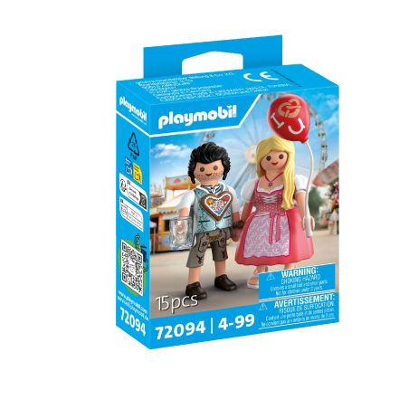 Playmobil-Box mit zwei Figuren in bayerischer Tracht, eine hält einen roten Ballon und eine Brezel.
