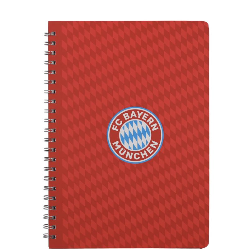 Rotes Spiralnotizbuch mit zentralem FC Bayern München-Logo auf dem Cover und rautenförmigem Hintergrund.