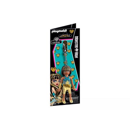 Playmobil Monster High Puppe im goldenen Outfit, mit Zubehör und farbenfroher Verpackung.