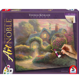 Box eines Thomas-Kinkade-Malsets mit Häuschenszene und einer Hand, die nummerierte rosa Blumen ausmalt.