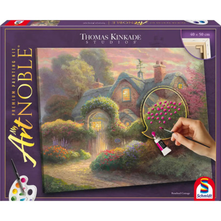 Box eines Thomas-Kinkade-Malsets mit Häuschenszene und einer Hand, die nummerierte rosa Blumen ausmalt.
