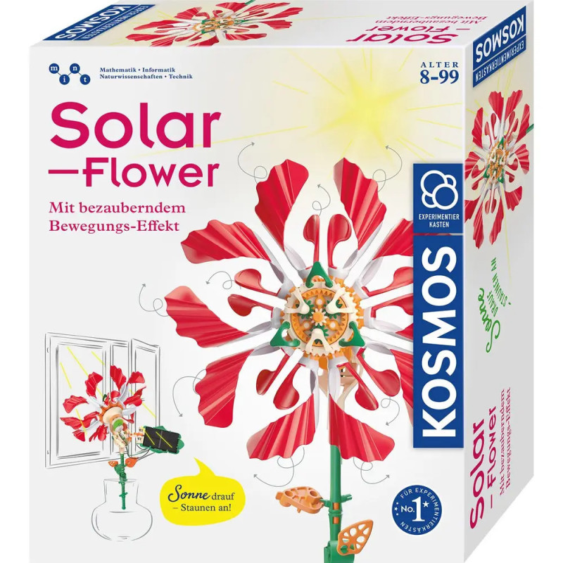 Box eines Kosmos Solar-Flower Sets mit einer rot-rosa mechanischen Blume im Sonnenlicht.