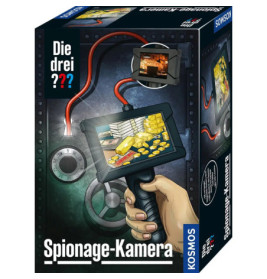 Eine Hand hält eine Spionagekamera, die Goldbarren und Münzen zeigt im Hintergrund sind ein Tresor und Kabel zu sehen.