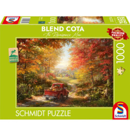 Ein roter Truck fährt auf einer Landstraße durch herbstliche Bäume, illustriert auf einer Schmidt-Puzzlebox.