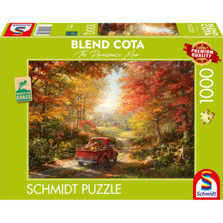 Ein roter Truck fährt auf einer Landstraße durch herbstliche Bäume, illustriert auf einer Schmidt-Puzzlebox.