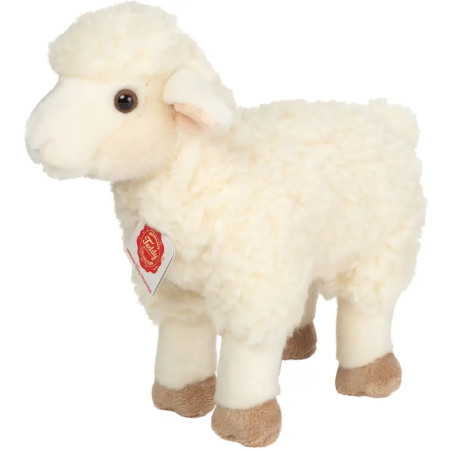 Weißes Plüschschaf mit flauschigem Fell, braunen Füßen und rotem Anhänger am Hals.